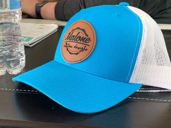 Custom cap with laser engraved leatherette patch.